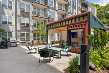 Outdoor bar with fireplace lounge